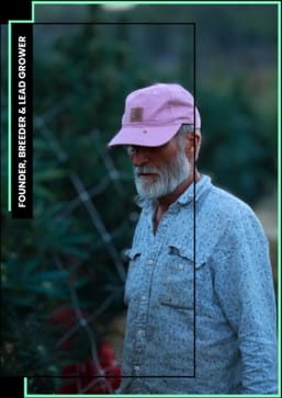 Victor Fresquet, founder, breeder and lead grower, standing among plants